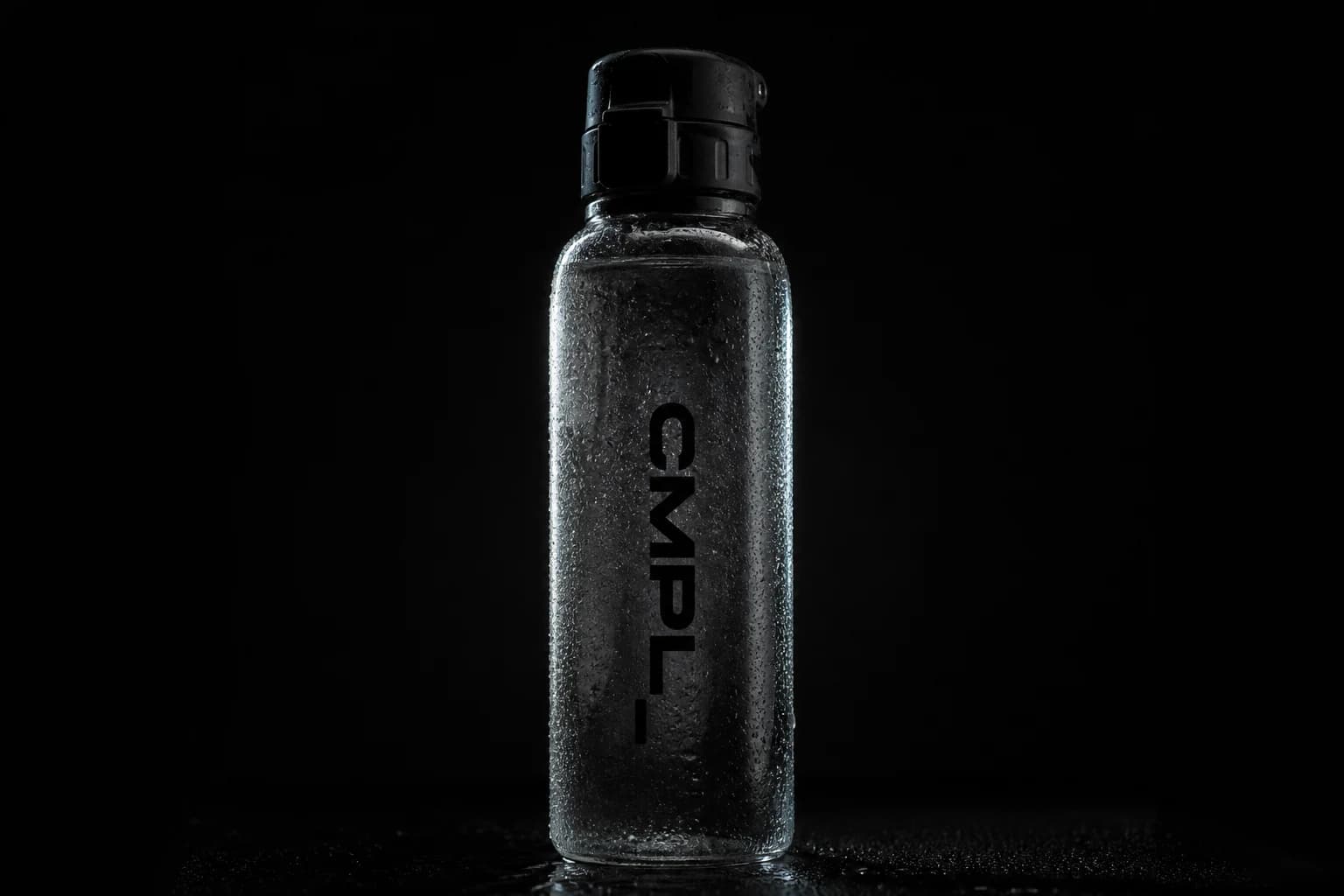 CMPL water bottle resting on clear ice